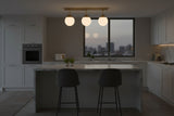 Valencia 3-light glass globe ceiling light with brushed brass linear bar and warm glowing white globe shades