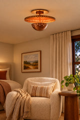 Valencia brass ceiling light creating decorative circular shadow patterns across the ceiling when illuminated