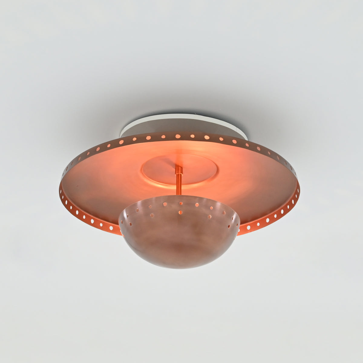 Solid brass flush mount chandelier with copper finish, perforated rim and rounded central bowl