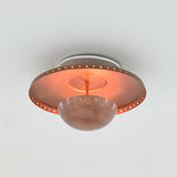 Solid brass flush mount chandelier with copper finish, perforated rim and rounded central bowl