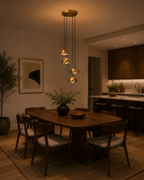 Verona Cascade Dome Multi Pendant Chandelier 4 Light installed above a contemporary dining table, adding warm ambient lighting to a modern dining room.