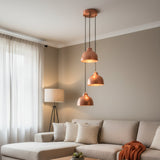 Front view of Verona 3-light hammered copper pendant chandelier illuminated with warm light – Model 33221
