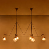 Warm ambient glass globe chandelier with ribbed shades, ideal for dining rooms, living rooms, and hospitality interiors
