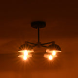 4 light industrial ceiling chandelier casting warm ambient glow in a dark interior