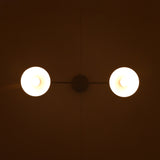 Bottom view of dual dome pendant with both lights glowing softly in symmetry