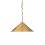 Closeup of wide cone brass pendant shade with warm glowing bulb and elegant metal finish detail