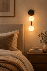 Zurich dual globe wall sconce installed inside an illuminated arched wall niche with warm decorative ambient lighting