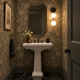 Zurich dual globe wall sconce installed inside an illuminated arched wall niche with warm decorative ambient lighting